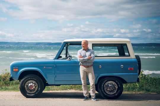 a person in front of a blue truck