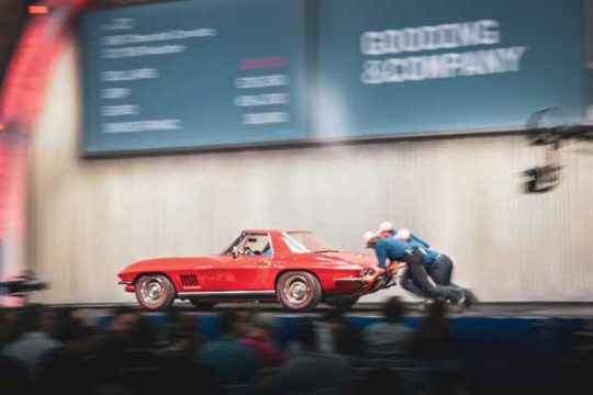 a red car on an auction block