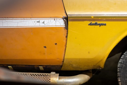 the side of a vintage car, up close.